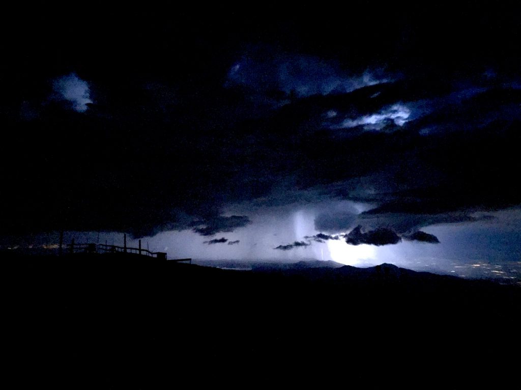 This picture of lightning striking somewhere below was the last photo I took on my last day working on top of Pikes Peak on my way to the van down. 